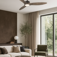 Modern living room with a ceiling fan, sofa, armchair, and large window.